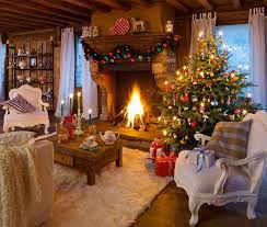 A living room with a fireplace and christmas tree
